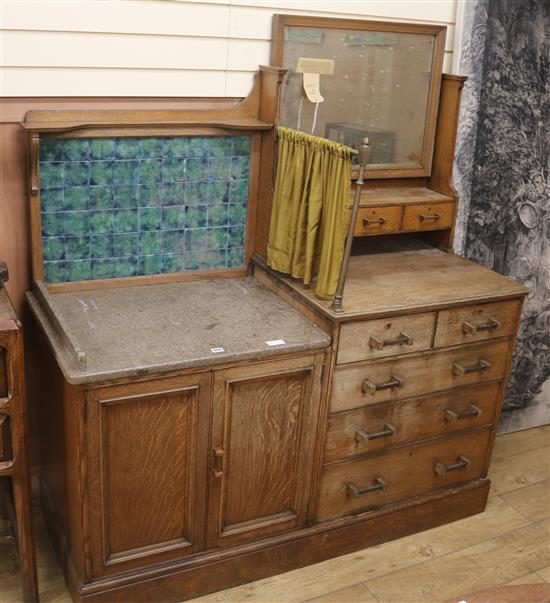 An Arts & Crafts oak frame mirror and an oak dressing unit, W.151cm